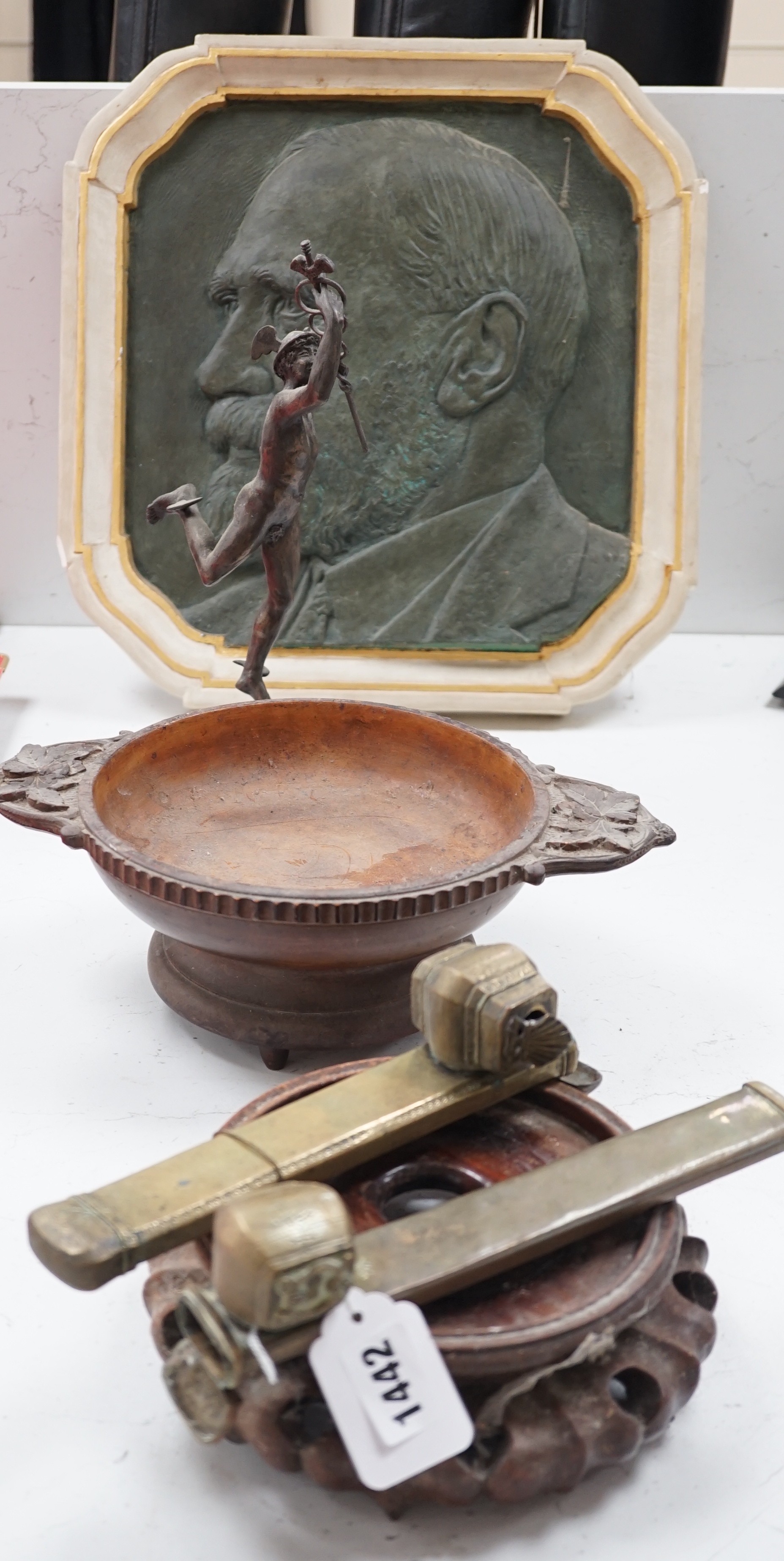 A Spelter figure of Mercury, a musical Black Forest carved wooden bowl, a Chinese carved wood vase stand, two Persian scribes boxes and a painted bronzed plaster plaque (6)
